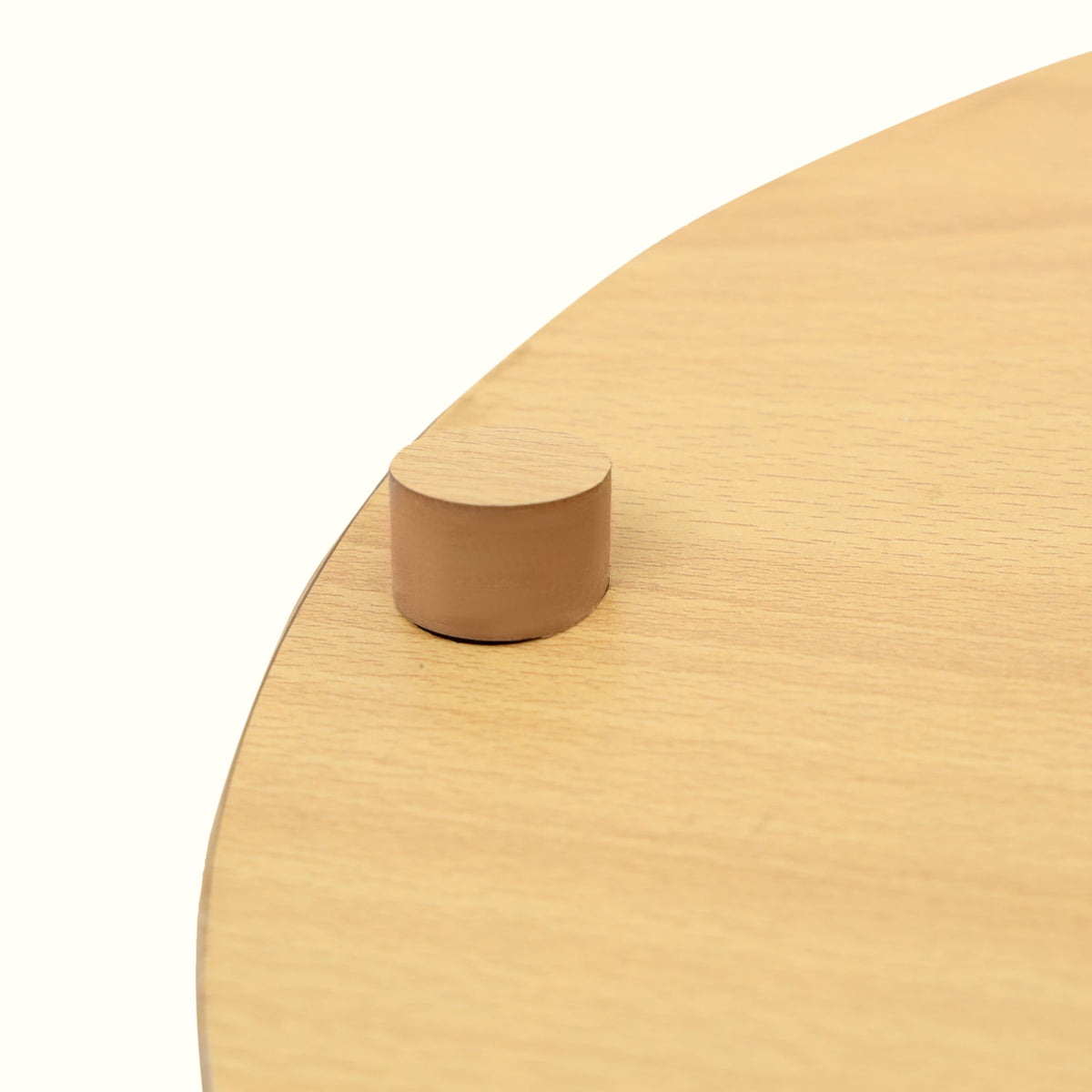 Close up of light wood top on basket side table