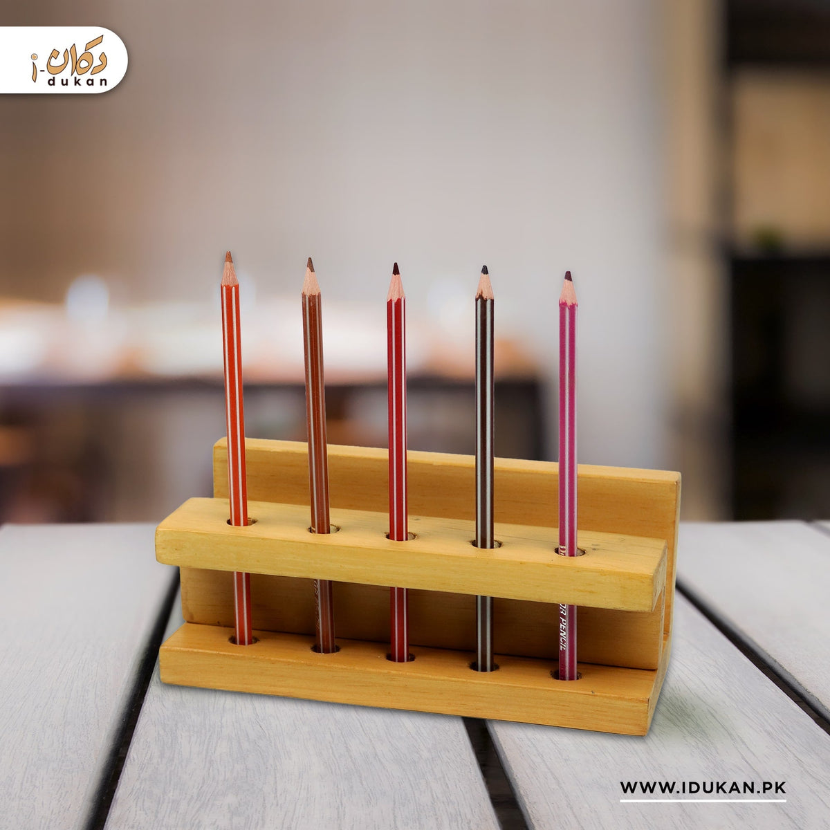 Wooden pen holder stand with pens on study table