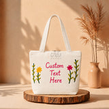 Custom embroidered tote bag with flower embroidery on wooden stand