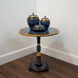 Golden blue hand painted coffee table on wooden floor