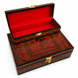 Large red wooden jewelry box open with red velvet lining