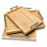 Stacked kail wood serving trays with metal handles