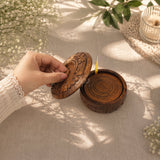 Taking coaster out of carved sheesham wood holder