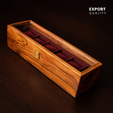 Solid wood watch organizer box on dark background