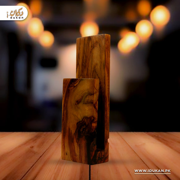 Wooden LED wall lamp glowing in dark room