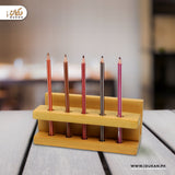 Wooden pen holder stand with pens on study table
