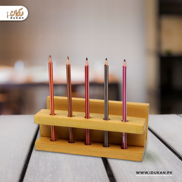 Wooden pen holder stand with pens on study table
