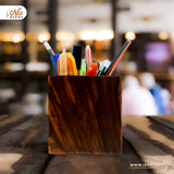 Wooden pen holder on office desk
