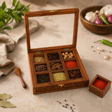 Wooden spice box with glass lid filled with spices
